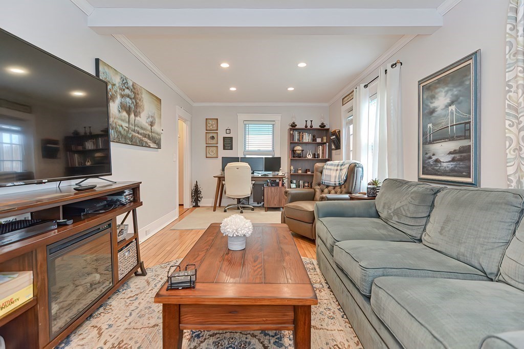 23 Dryden Street Worcester, MA 01605 - Photo 7 of 23 a living room with furniture and a flat screen tv