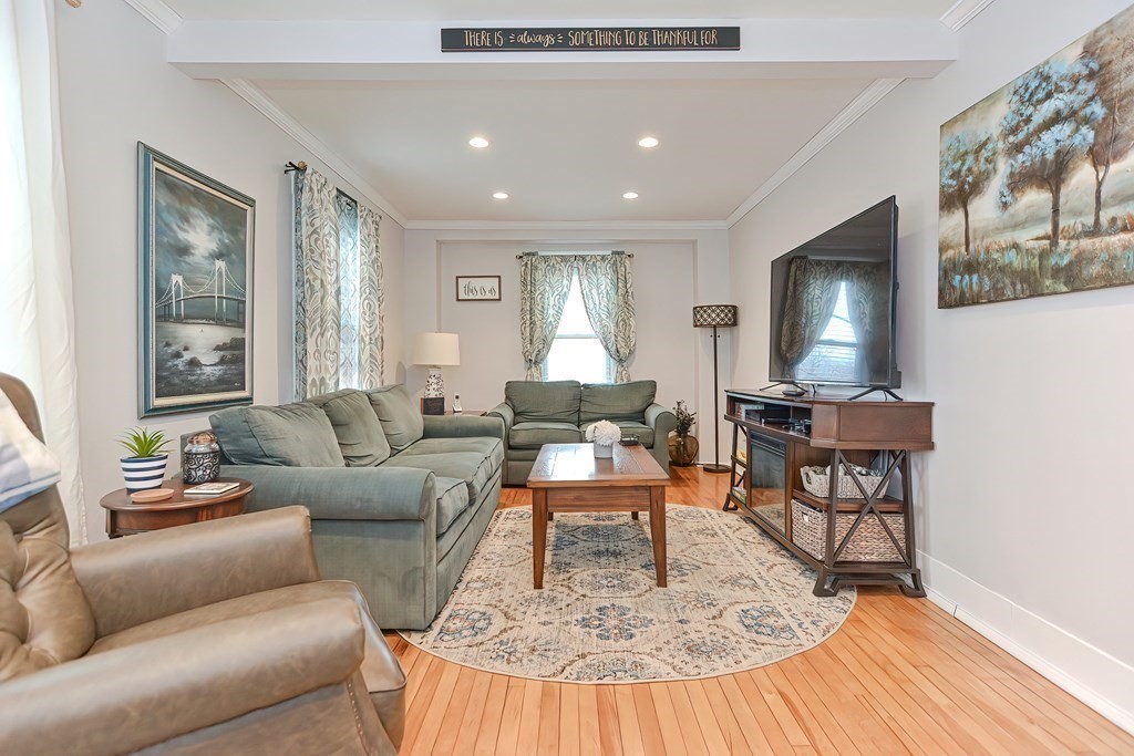 23 Dryden Street Worcester, MA 01605 - Photo 8 of 23 a living room with furniture and a fireplace