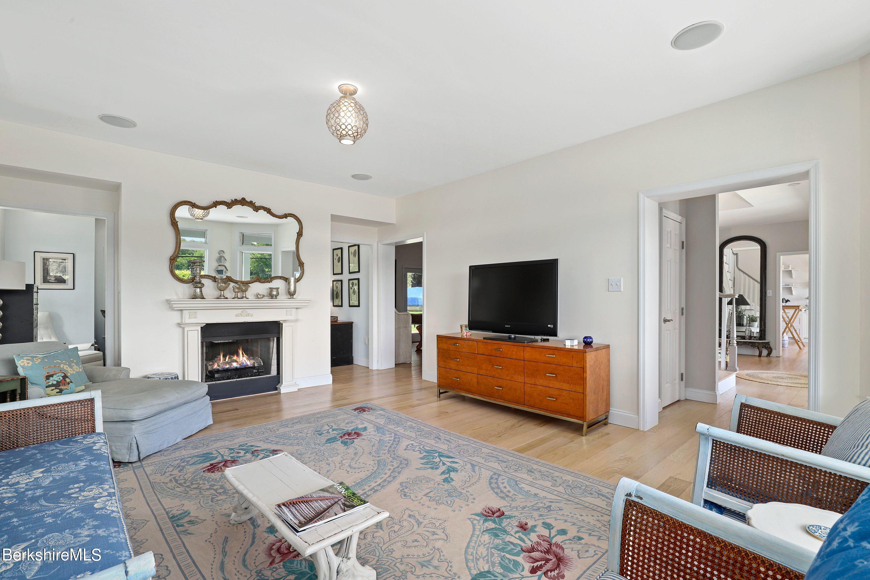271 B Lakeview Road Craryville, NY 12521 - Photo 11 of 23 a living room with furniture flat screen tv and a fireplace