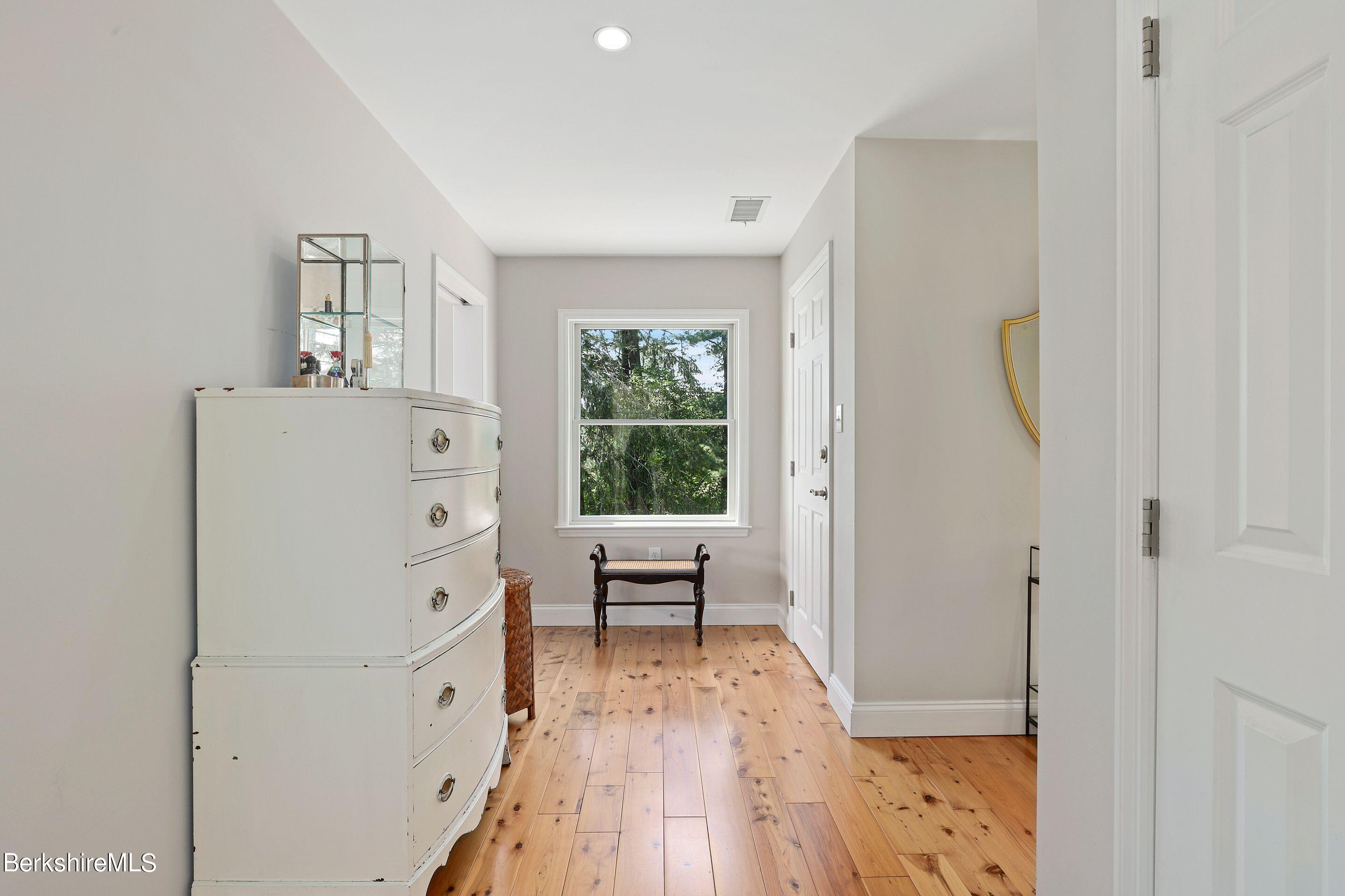271 B Lakeview Road Craryville, NY 12521 - Photo 15 of 23 a view of a hallway with windows and wooden floor