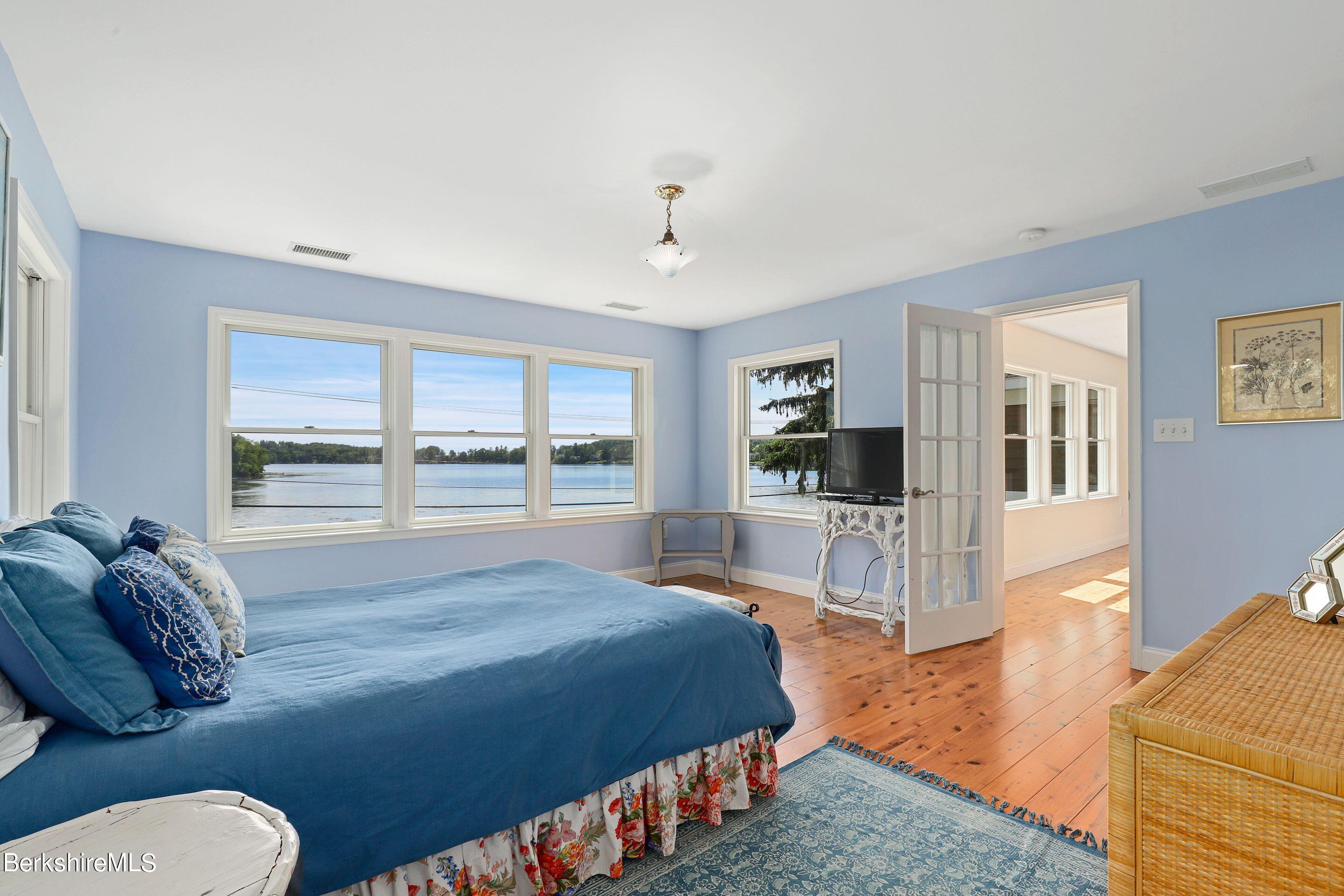 271 B Lakeview Road Craryville, NY 12521 - Photo 17 of 23 a spacious bedroom with a bed and a large window