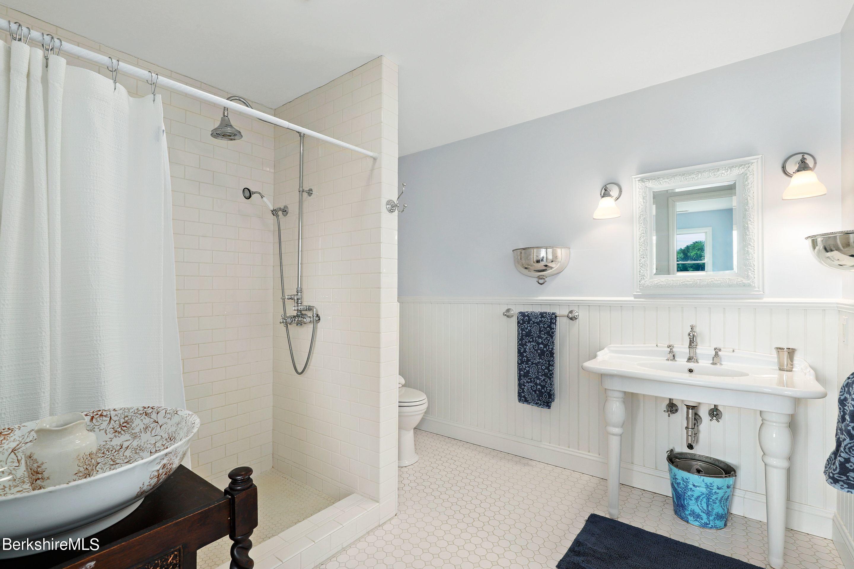 271 B Lakeview Road Craryville, NY 12521 - Photo 18 of 23 a bathroom with a sink toilet and shower
