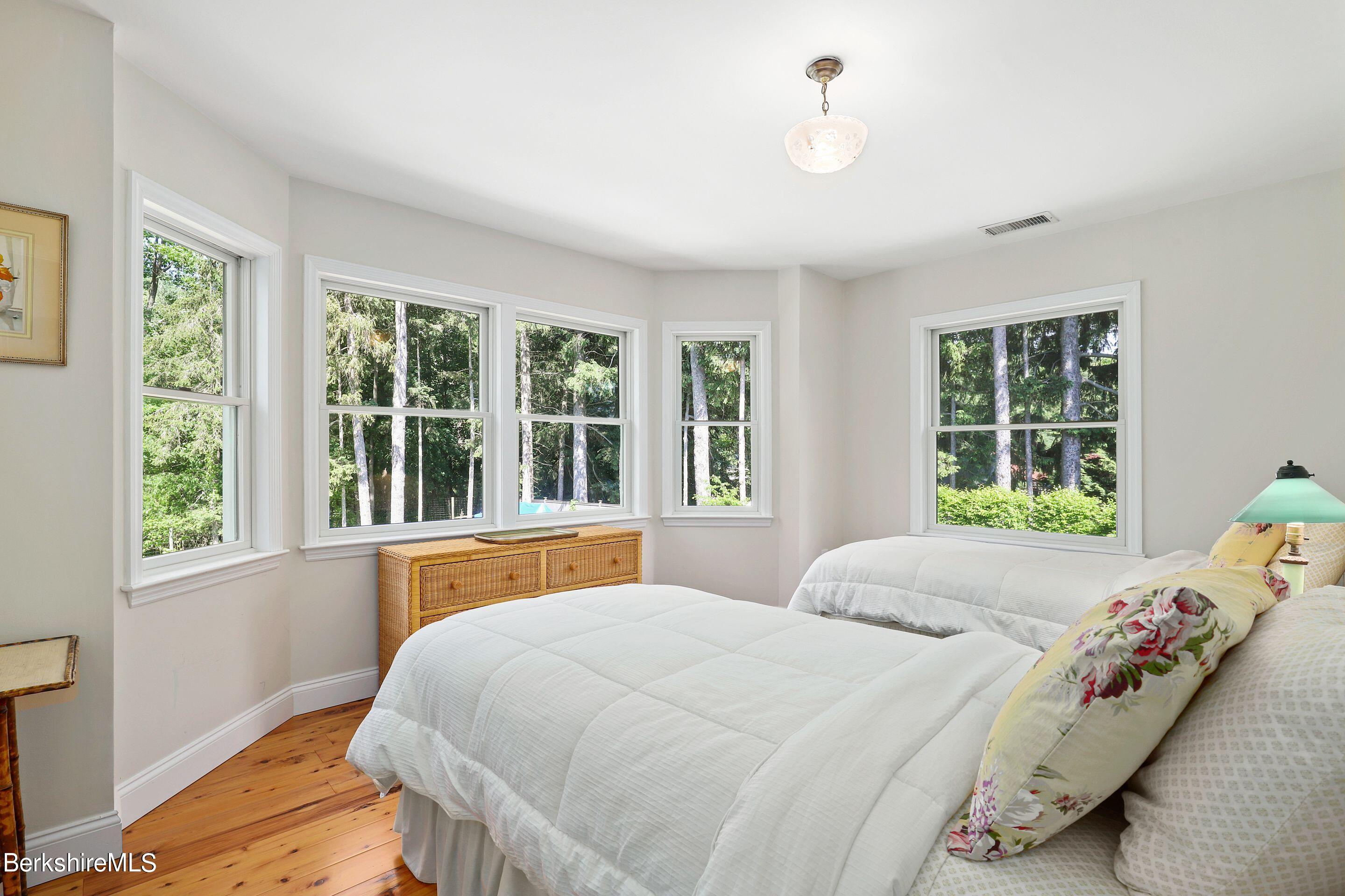 271 B Lakeview Road Craryville, NY 12521 - Photo 19 of 23 a bedroom with a bed and a large window