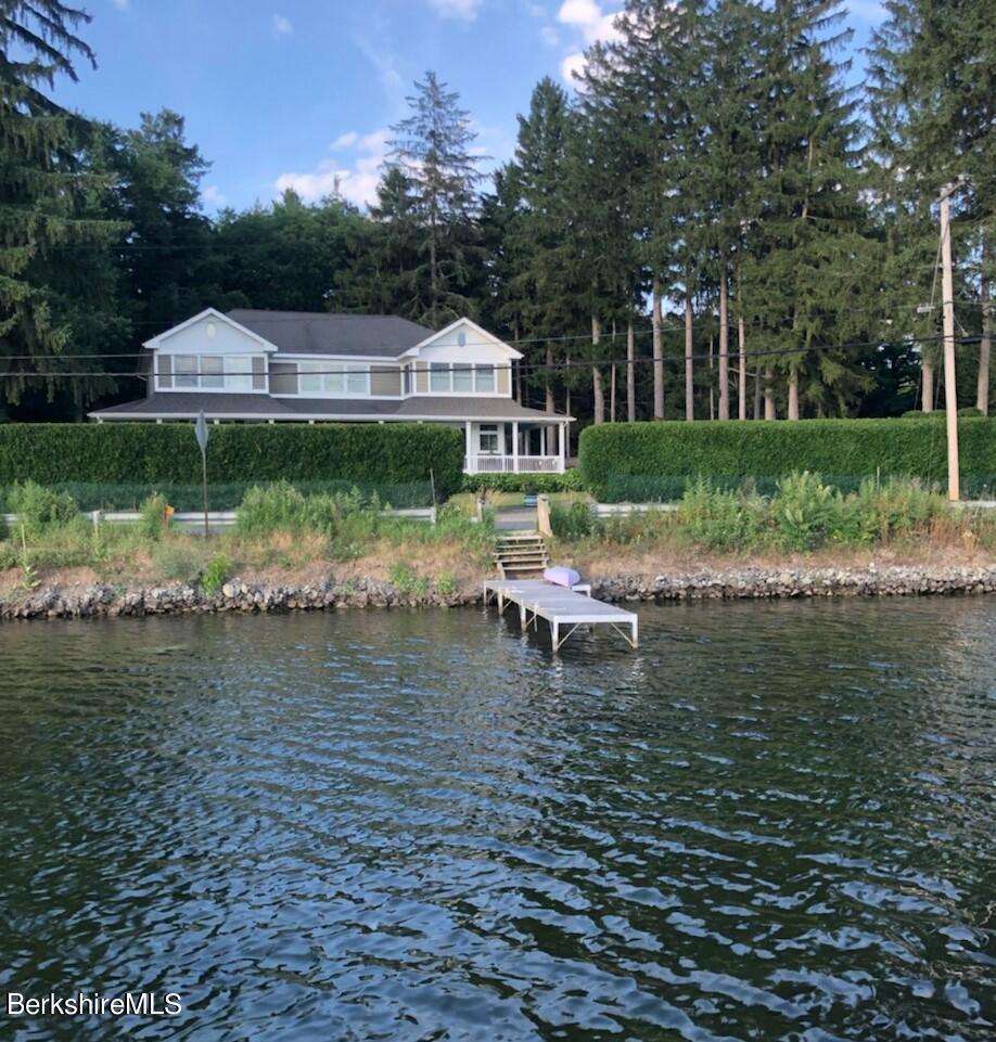 271 B Lakeview Road Craryville, NY 12521 - Photo 22 of 23 a view of a lake with a big yard potted plants and large tree