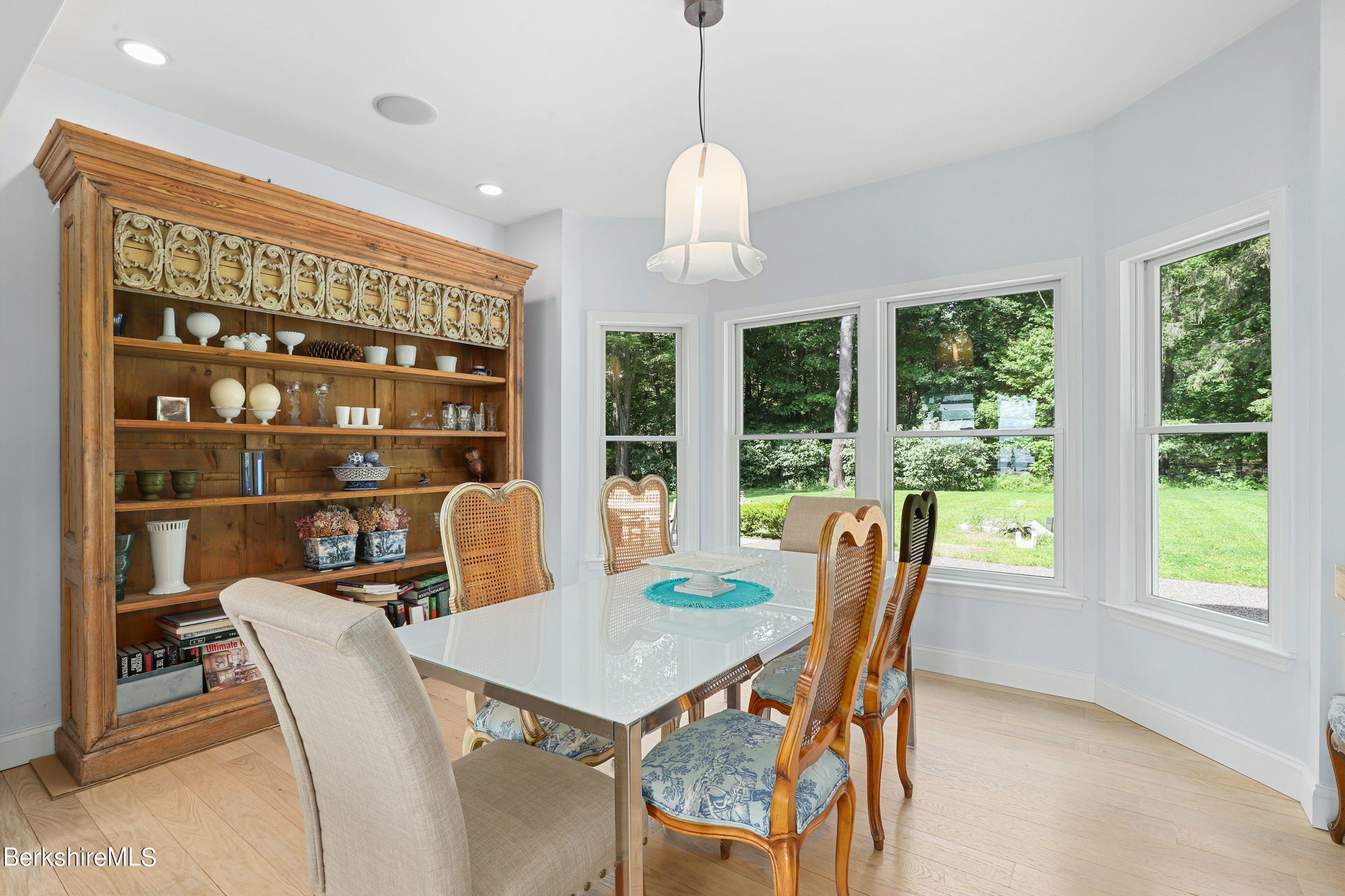 271 B Lakeview Road Craryville, NY 12521 - Photo 8 of 23 a dining room with furniture a chandelier and wooden floor