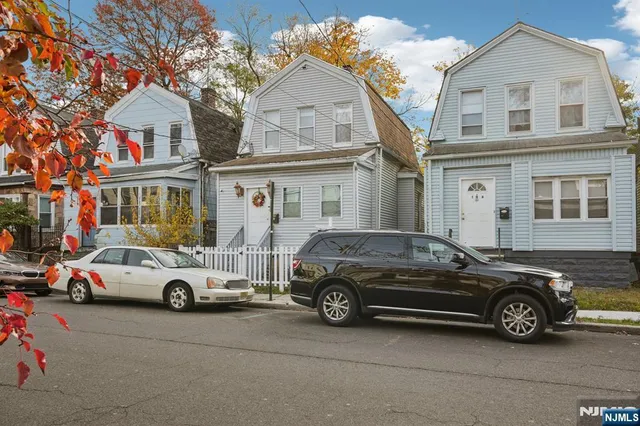 a car parked in front of a house
