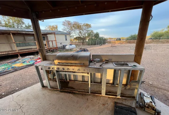a view of a chairs and table in the patio