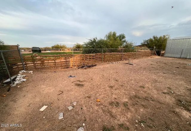 a view of yard with trees and car parked