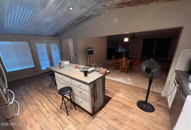 a room with table chairs and a flat screen tv