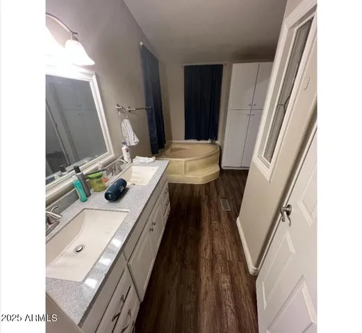 a bathroom with a sink toilet and mirror