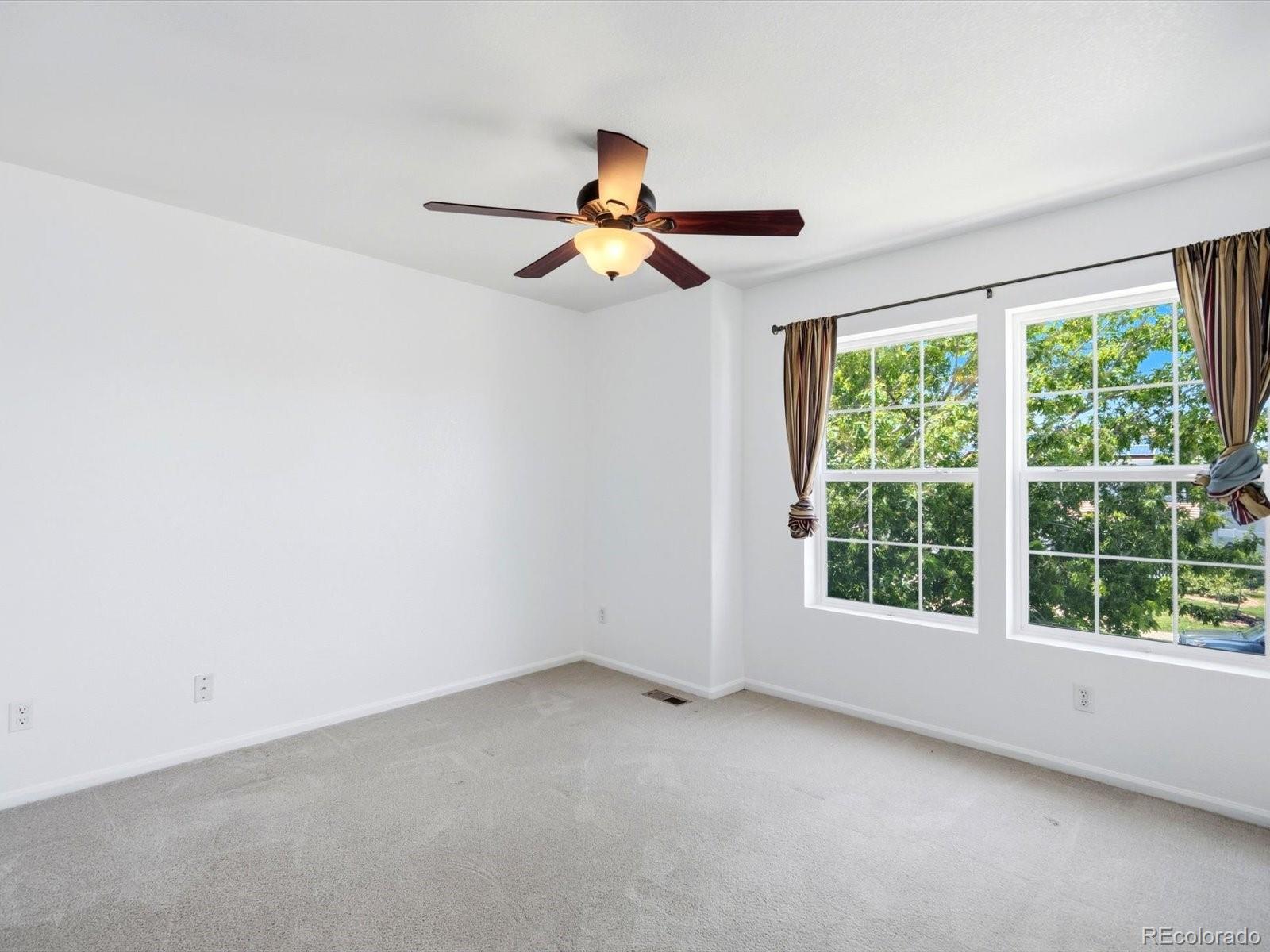 5444 Perth Court Denver, CO 80249 - Photo 32 of 46 an empty room with a window