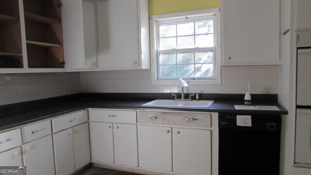 180 Dean Road Greenville, GA 30222 - Photo 6 of 10 a kitchen with a sink dishwasher and cabinets
