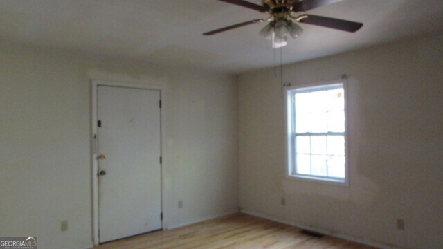 180 Dean Road Greenville, GA 30222 - Photo 8 of 10 a view of an empty room with a window