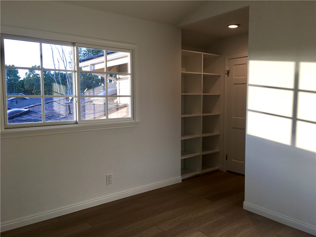 6 Dover Place Manhattan Beach, CA 90266 - Photo 7 of 25 an empty room with wooden floor and windows
