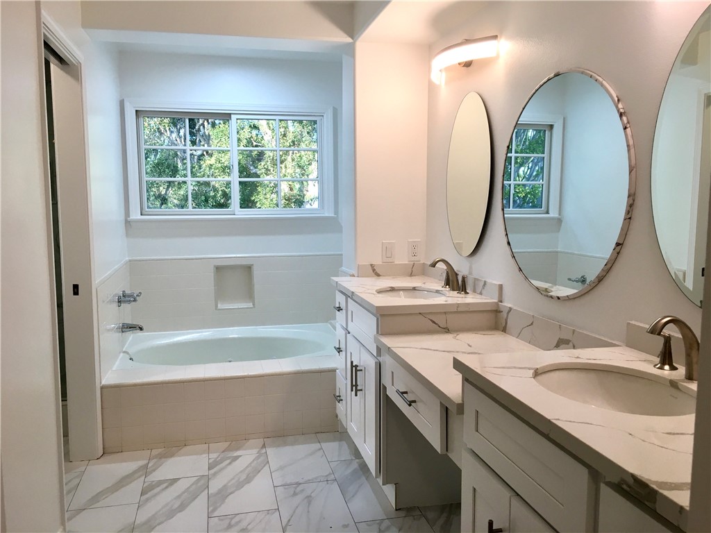 6 Dover Place Manhattan Beach, CA 90266 - Photo 9 of 25 a bathroom with a double vanity sink mirror and bathtub