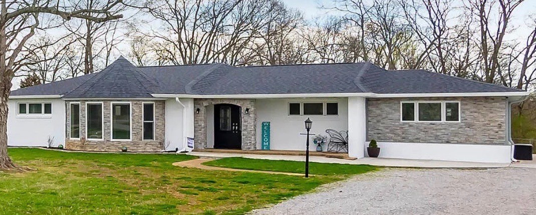 731 Baker Road Columbia, TN 38401 - Photo 1 of 30 a front view of a house with a garden and yard
