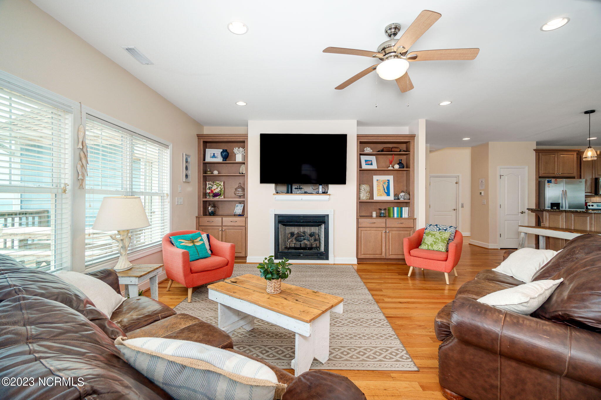 200 Ocean Boulevard Atlantic Beach, NC 28512 - Photo 11 of 75 Open living room w/ fireplace & views
