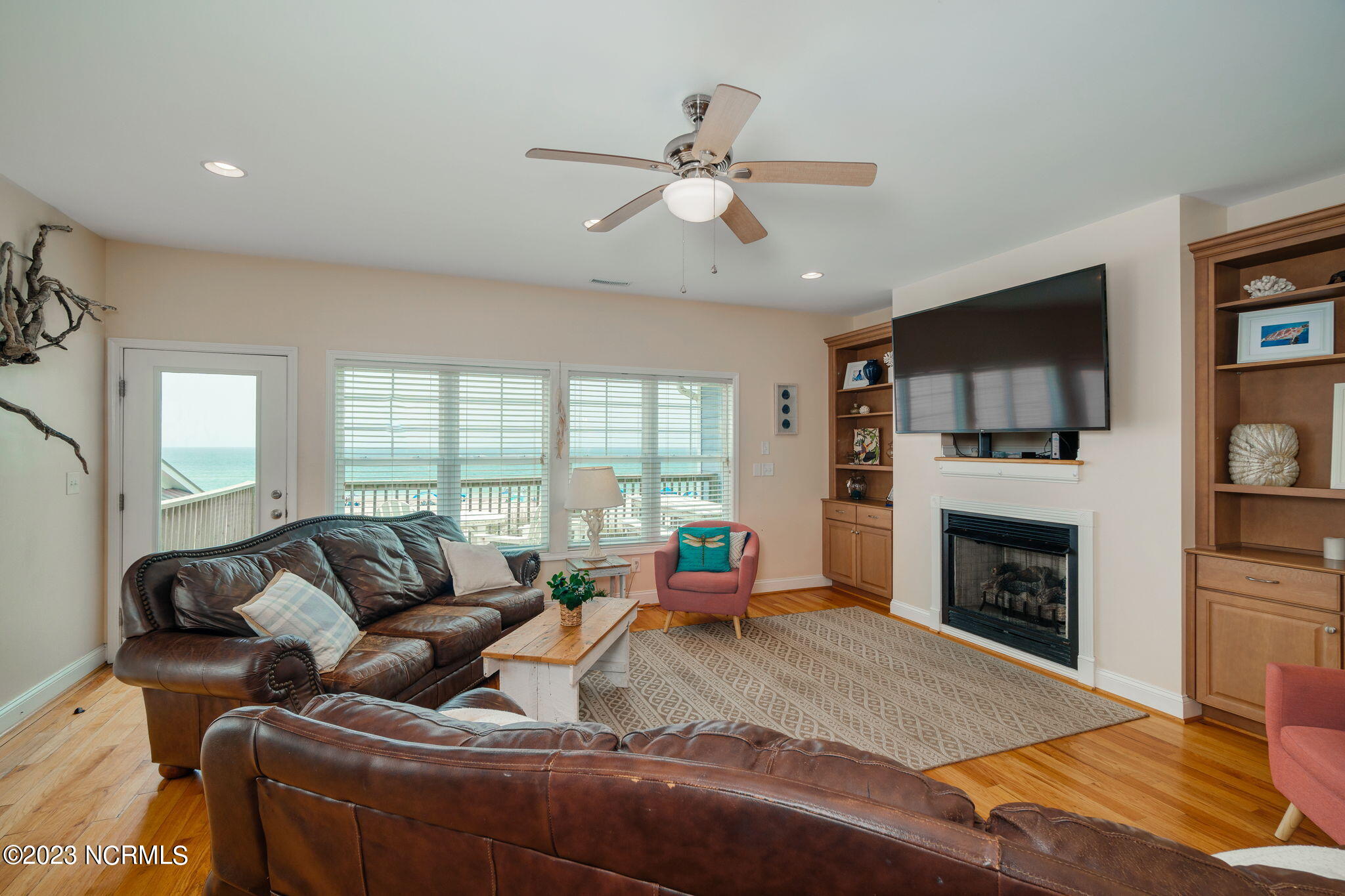 200 Ocean Boulevard Atlantic Beach, NC 28512 - Photo 12 of 75 Open living room w/ fireplace & views