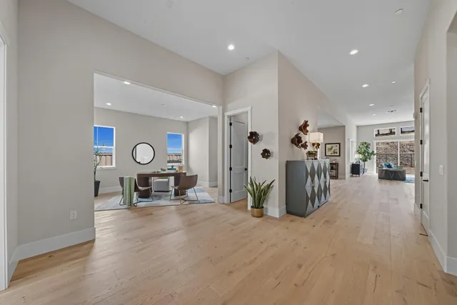 a view of a room with furniture and a clock