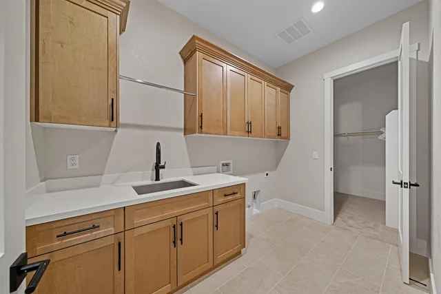 a kitchen with a sink and cabinets