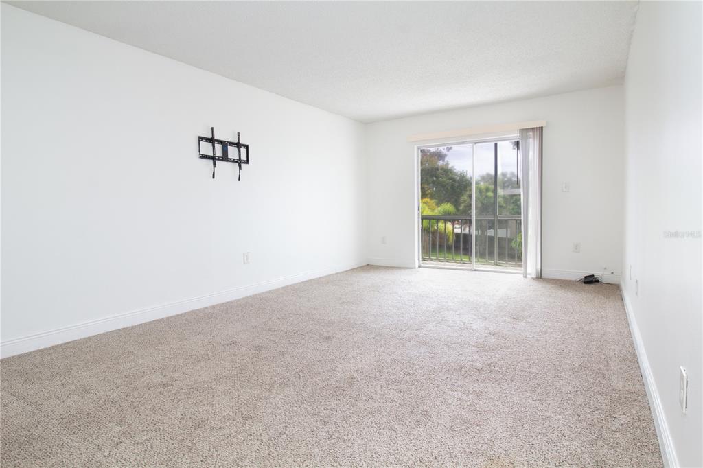 389 South McMullen Booth Road, Unit 12 Clearwater, FL 33759 - Photo 11 of 25 an empty room with windows