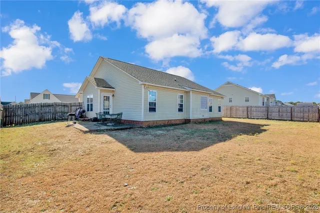 a view of a house with a snow in the yard