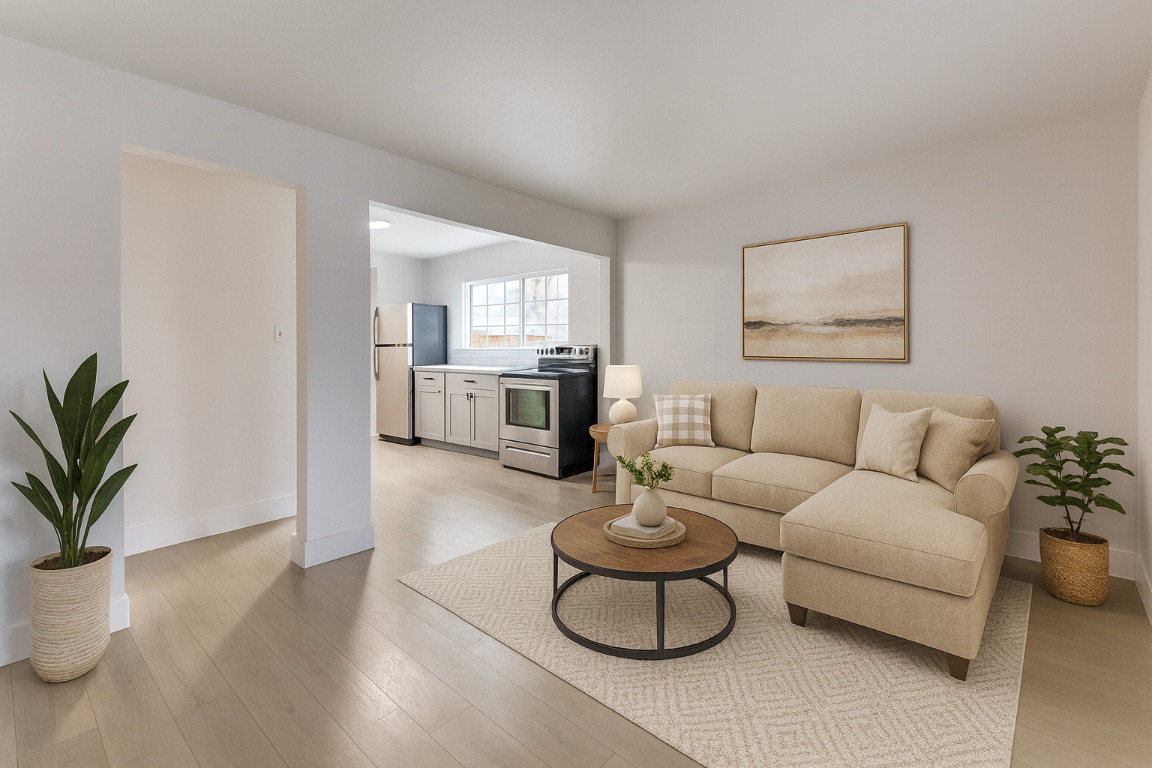 a living room with furniture and a potted plant