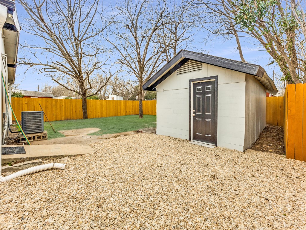 1108 Vasquez Street Austin, TX 78741 - Photo 29 of 34 Fully finished workshop with window unit AC, ready to be used as a flex space to suit your needs
