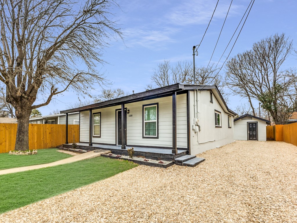 1108 Vasquez Street Austin, TX 78741 - Photo 3 of 33 front view of house with a yard