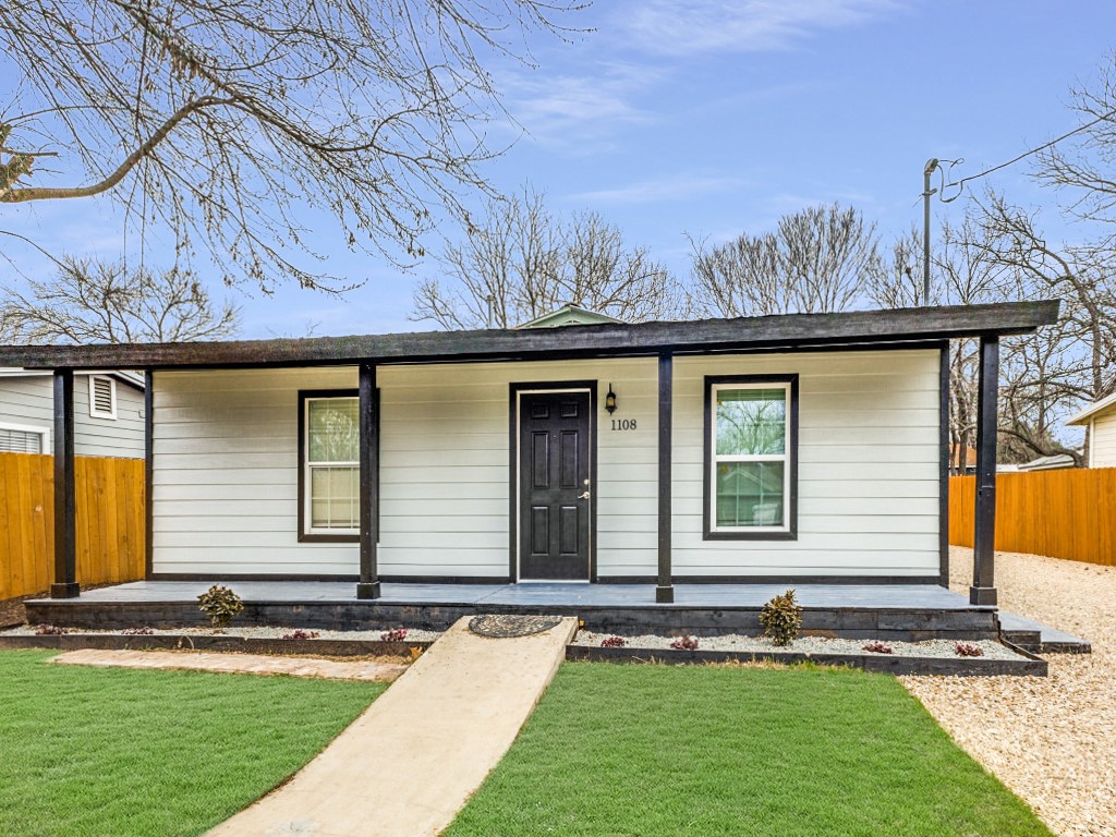 1108 Vasquez Street Austin, TX 78741 - Photo 10 of 33 a front view of a house with a yard