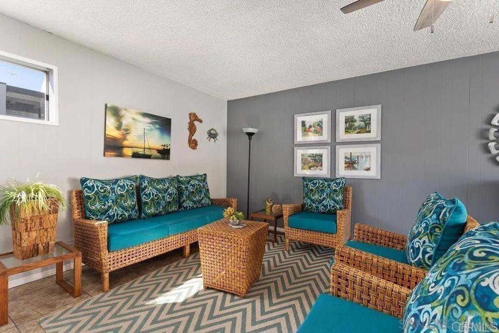 3606 Vista Rey, Unit 37 Oceanside, CA 92057 - Photo 38 of 45 a living room with furniture rug and window