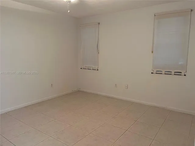 a bathroom with a shower a toilet and a sink