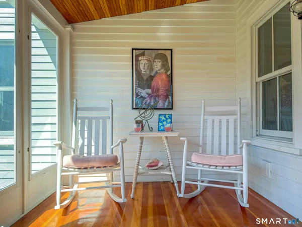 a bed sitting in a room next to a window