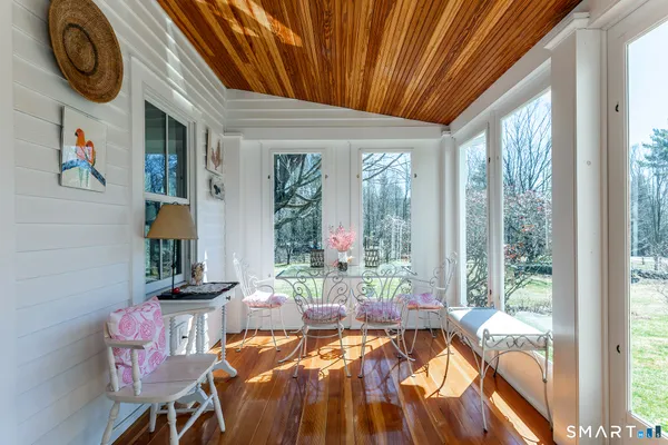 a room with furniture and a large window