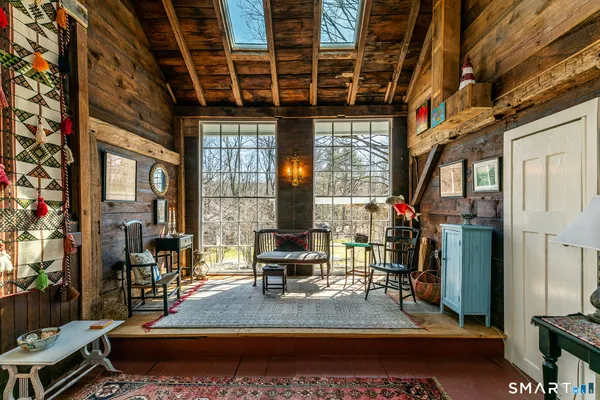 a large kitchen with stainless steel appliances granite countertop a lot of counter space and a sink