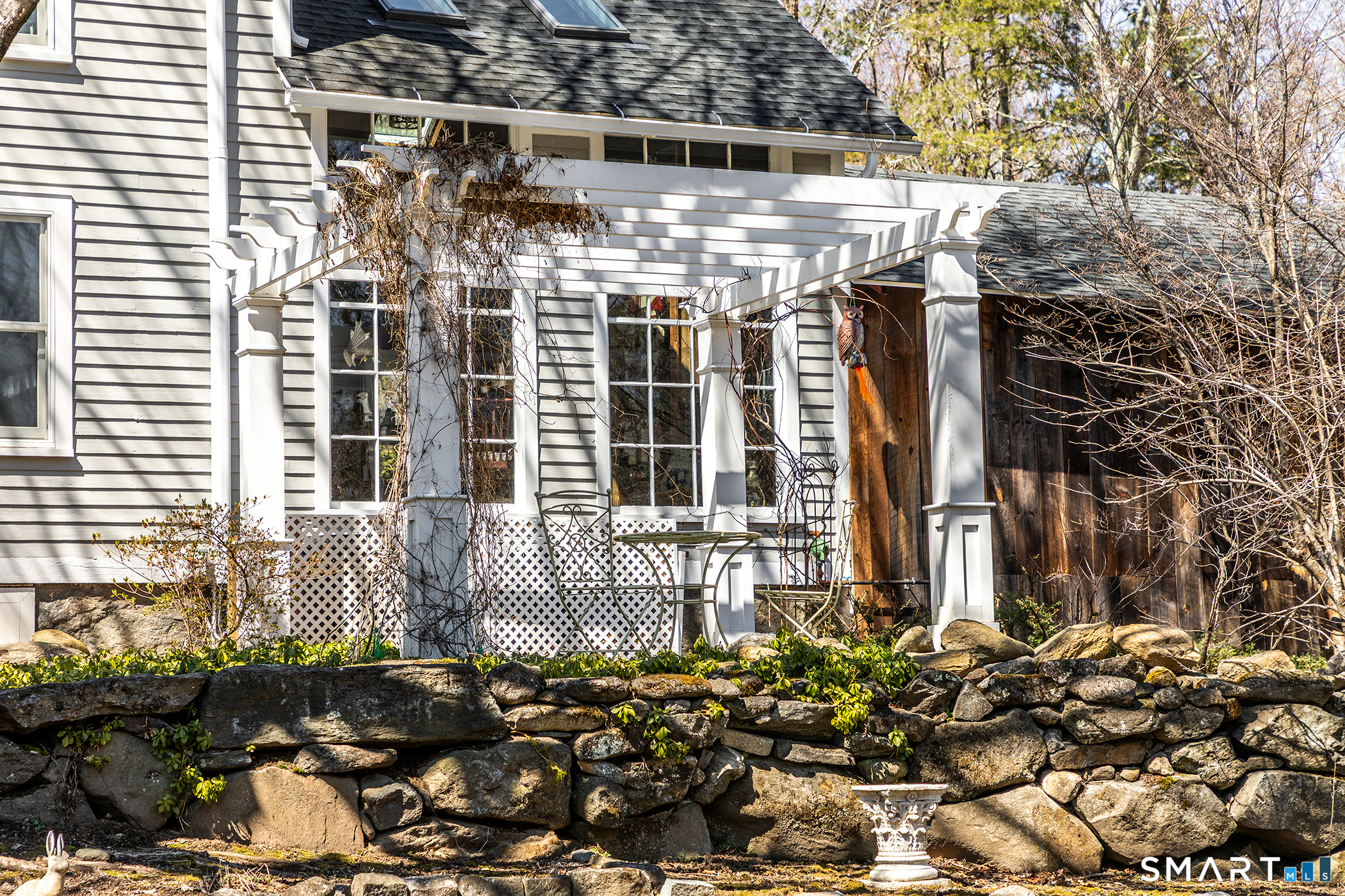 51 Mill Street Hartland, CT 06065 - Photo 32 of 36 a front view of a house with a garden