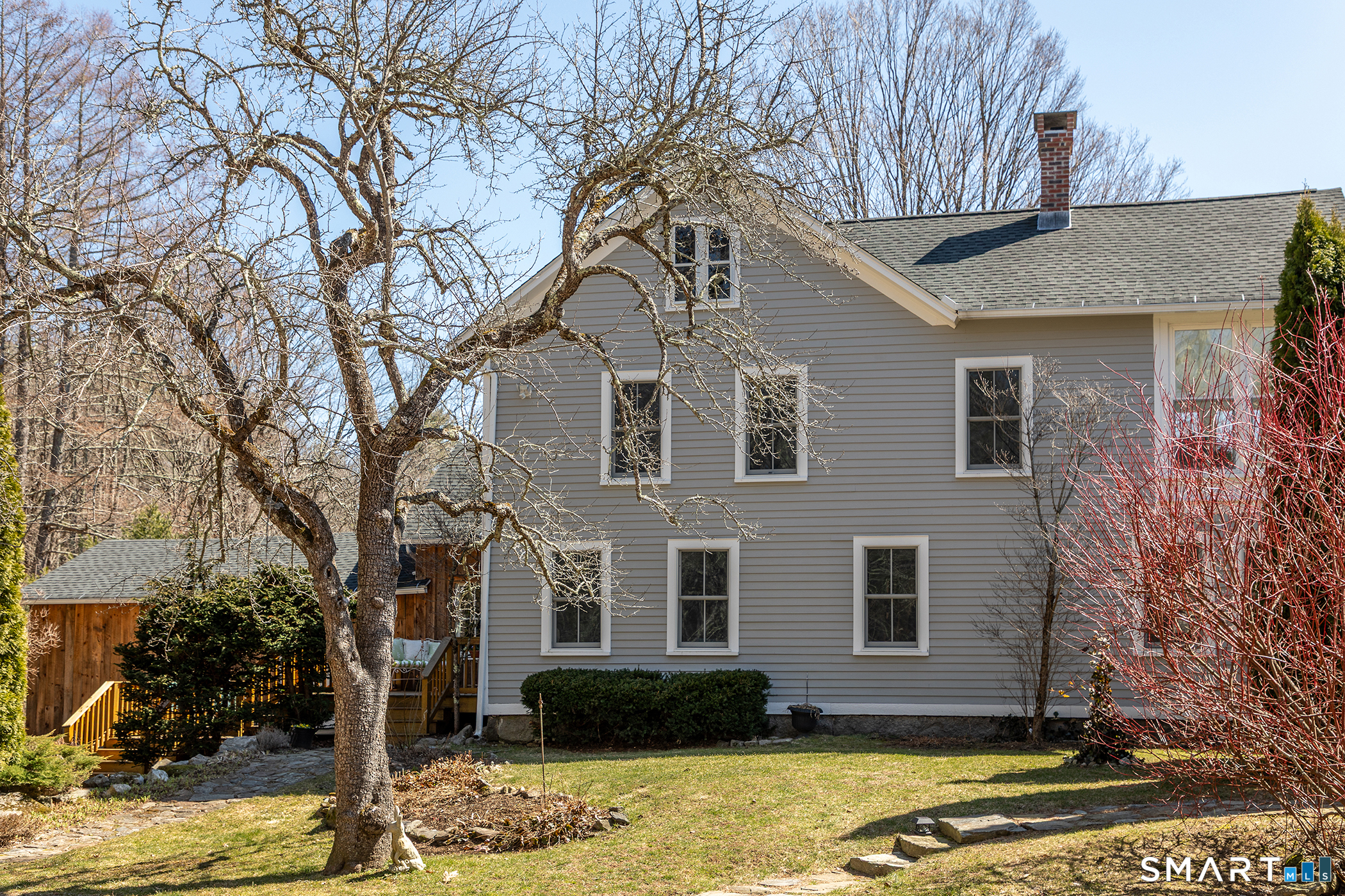 51 Mill Street Hartland, CT 06065 - Photo 34 of 36 a front view of a house with a yard and garage