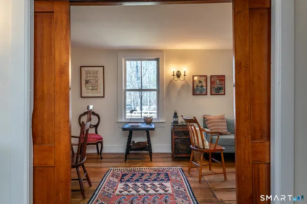 a view of a dining room with furniture window and wooden floor