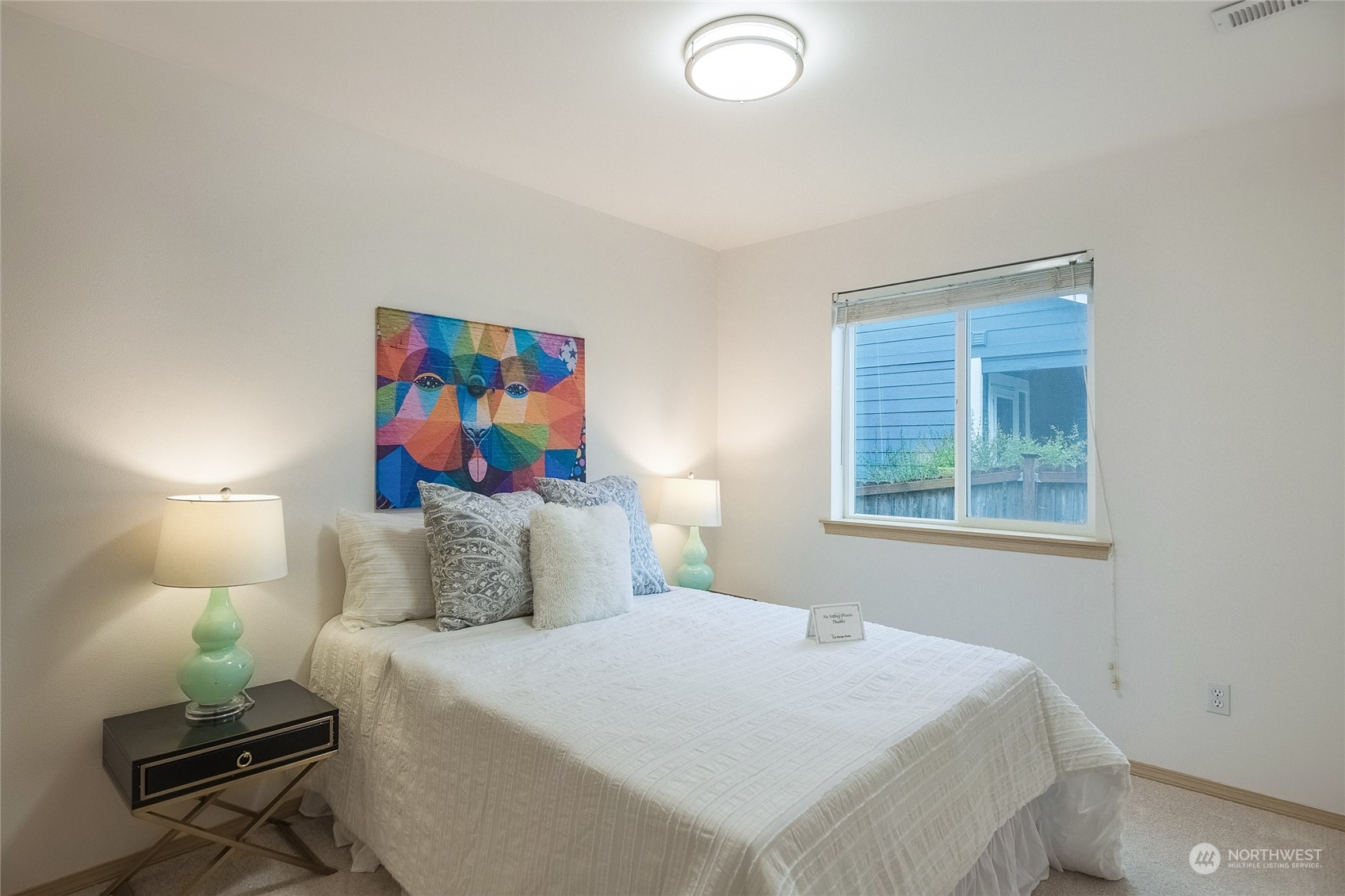 4013 152nd Place Southeast Bothell, WA 98012 - Photo 22 of 24 a bedroom with a bed and a painting on the wall