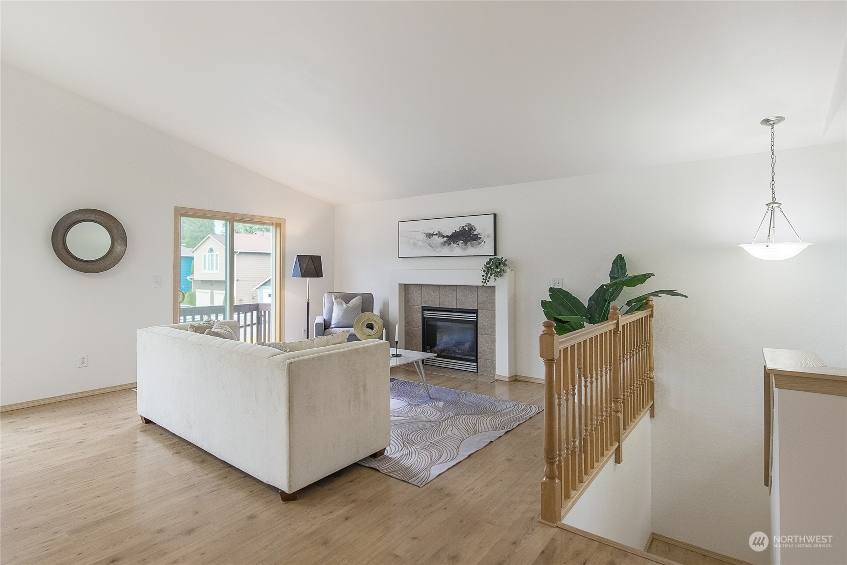 4013 152nd Place Southeast Bothell, WA 98012 - Photo 3 of 24 a living room with furniture a fireplace and a potted plant
