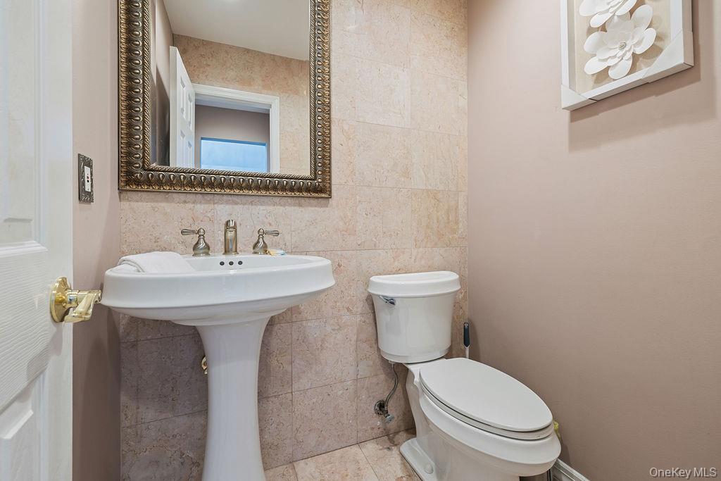 14 Blue Note Drive Stony Point, NY 10980 - Photo 19 of 48 a bathroom with a toilet sink and mirror