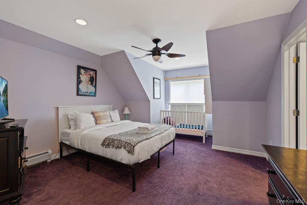 14 Blue Note Drive Stony Point, NY 10980 - Photo 22 of 48 a spacious bedroom with a bed and a ceiling fan