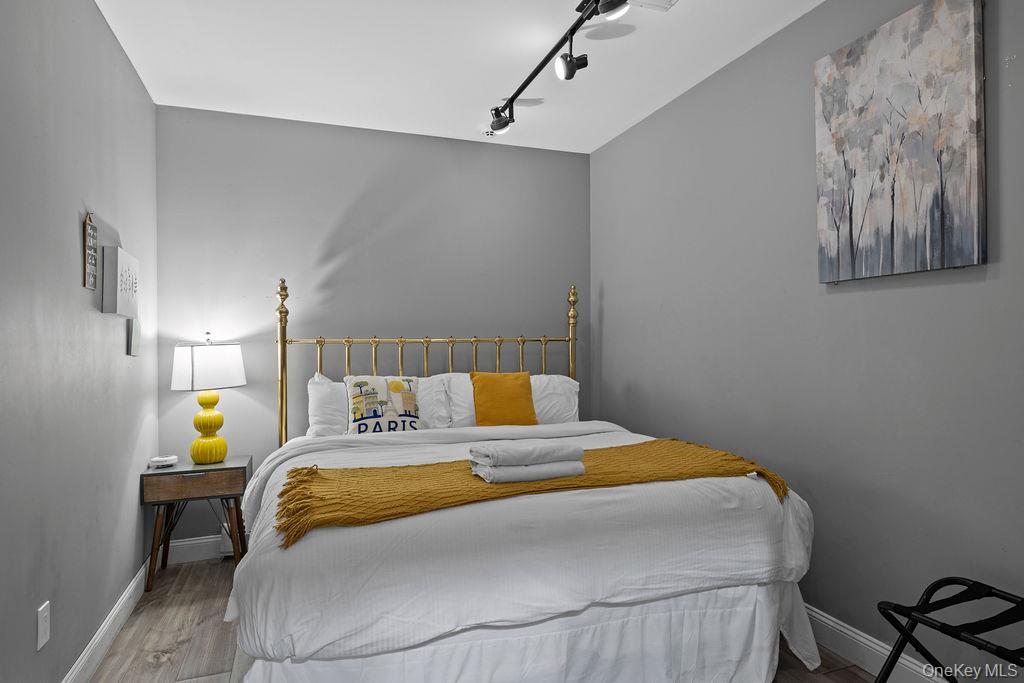 14 Blue Note Drive Stony Point, NY 10980 - Photo 33 of 48 a bedroom with a bed and a lamp on the dresser