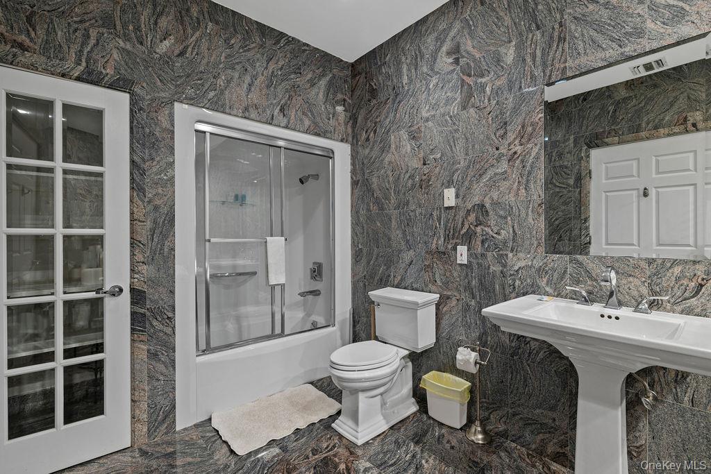 14 Blue Note Drive Stony Point, NY 10980 - Photo 38 of 48 a bathroom with a toilet a sink and shower