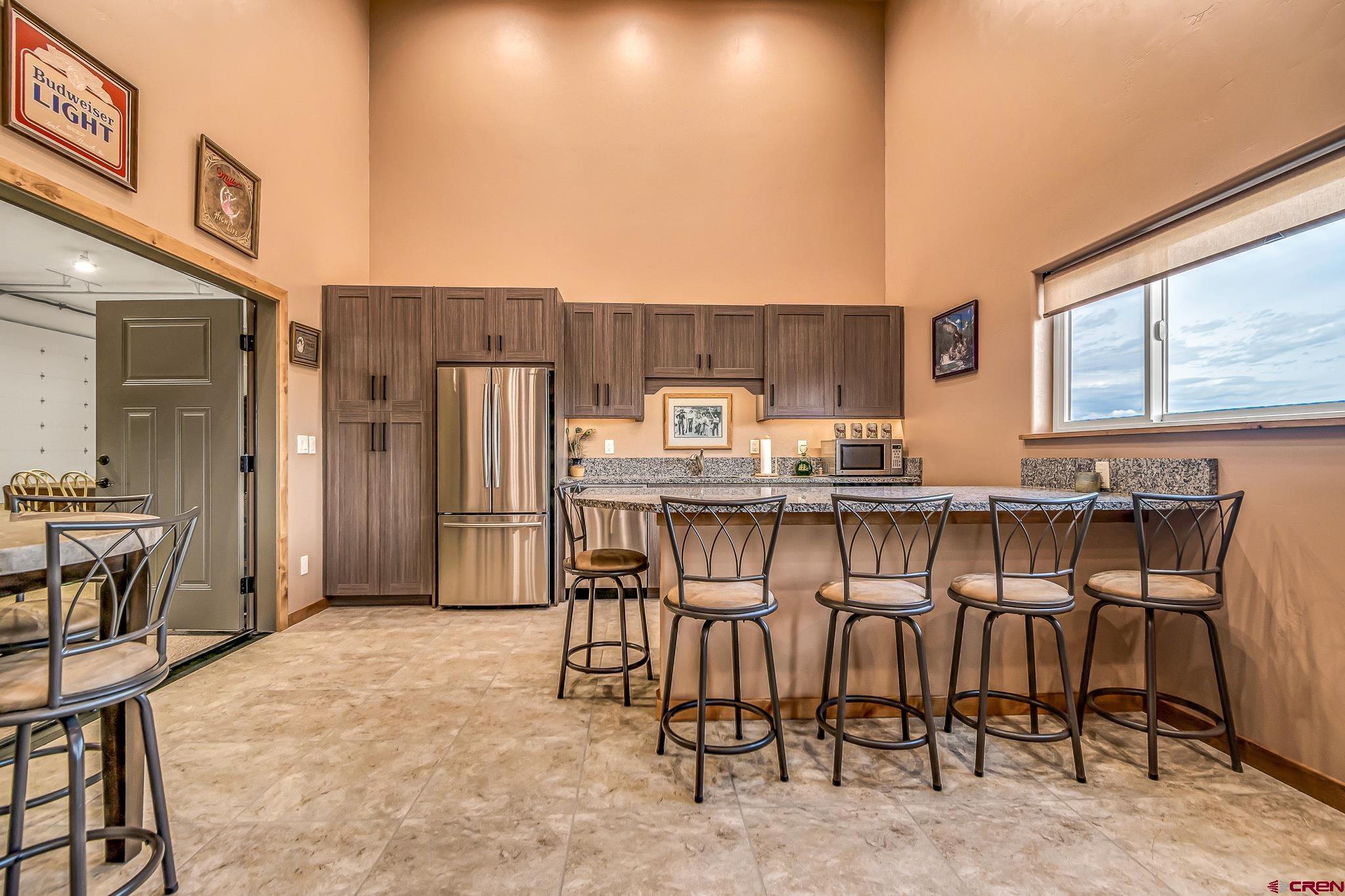 18236 6300th Road Montrose, CO 81403 - Photo 24 of 35 Entertain your friends and family in the recreation room equipped with a wet bar.