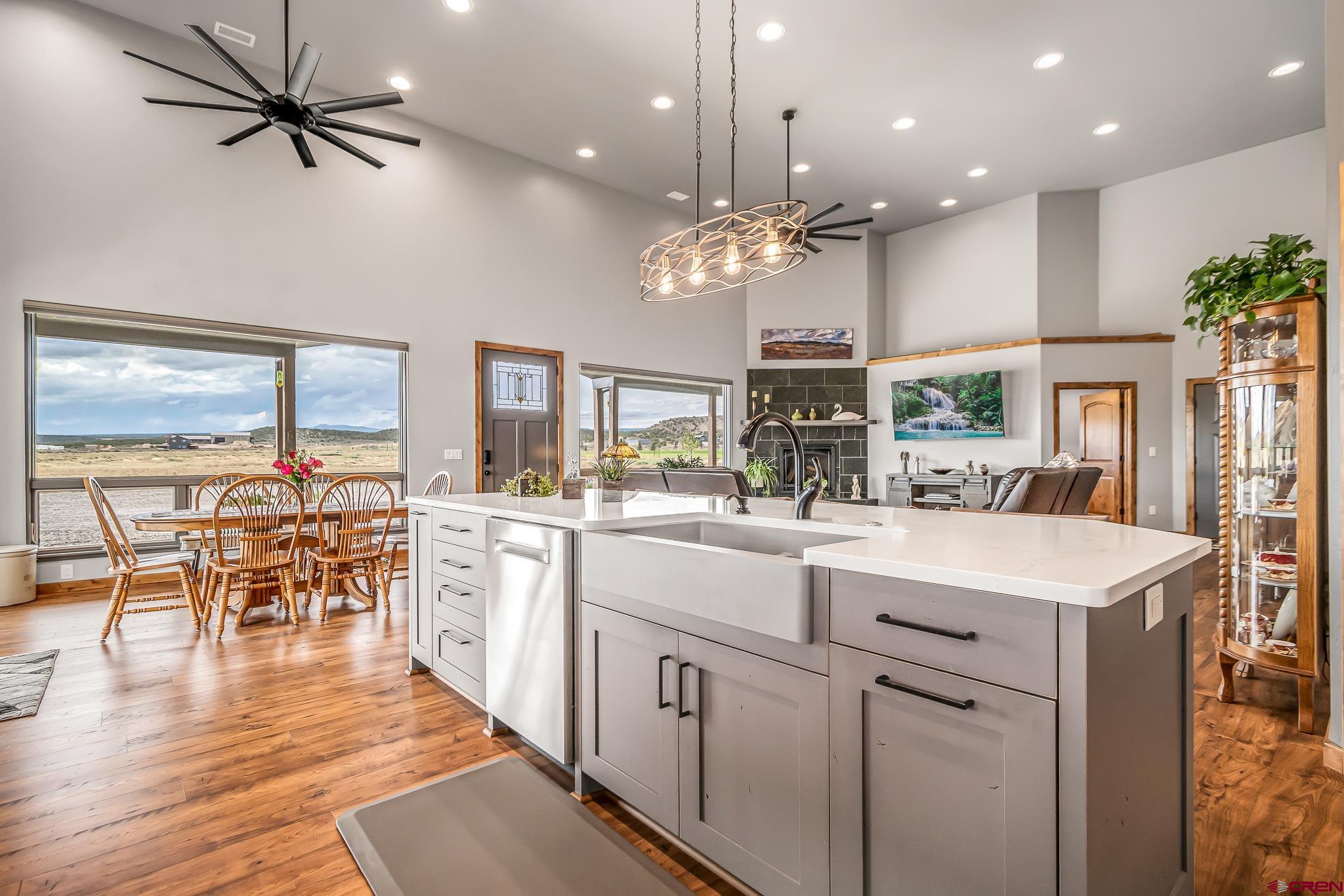 18236 6300th Road Montrose, CO 81403 - Photo 8 of 35 Open and spacious, custom 'soft close' cabinetry, quartz counter tops, kitchen island