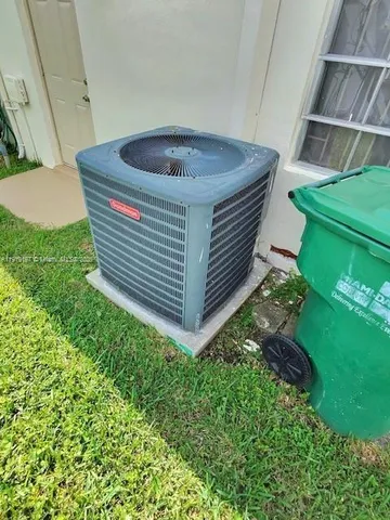 a view of backyard with swimming pool and outdoor seating