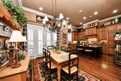 a living room with lots of furniture and kitchen view