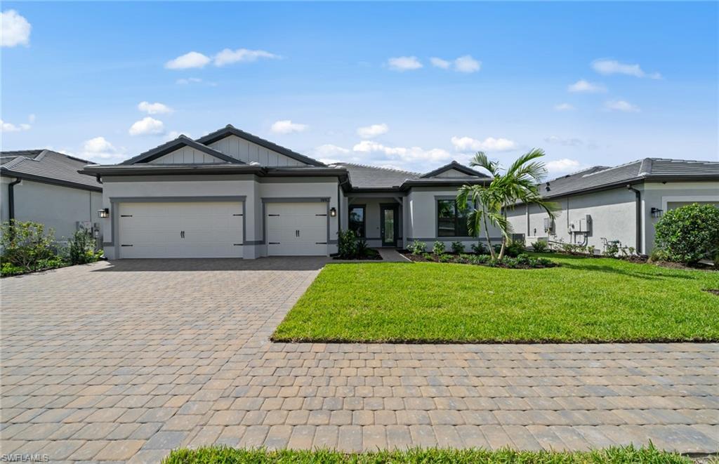 1992 Don Benito Way Naples, FL 34120 - Photo 31 of 49 Front of home - 3-car garage