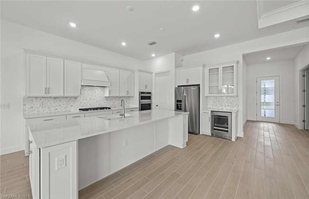 1992 Don Benito Way Naples, FL 34120 - Photo 6 of 49 Built in kitchen with enterainment package